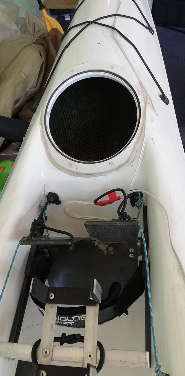 Wiring from the flashlight along the front deck to the cockpit and battery, then to a switch under the side handle, plus the cradle for battery bank and cellphone