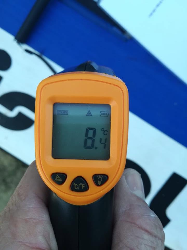 Infrared thermometer reading 8.4 degrees on the board at camp