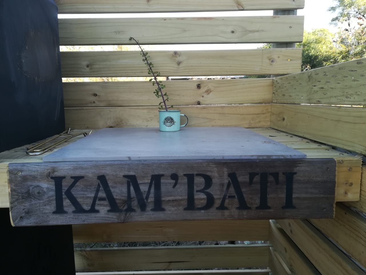 A wooden sign reading Kam'Bati at the overnight stop