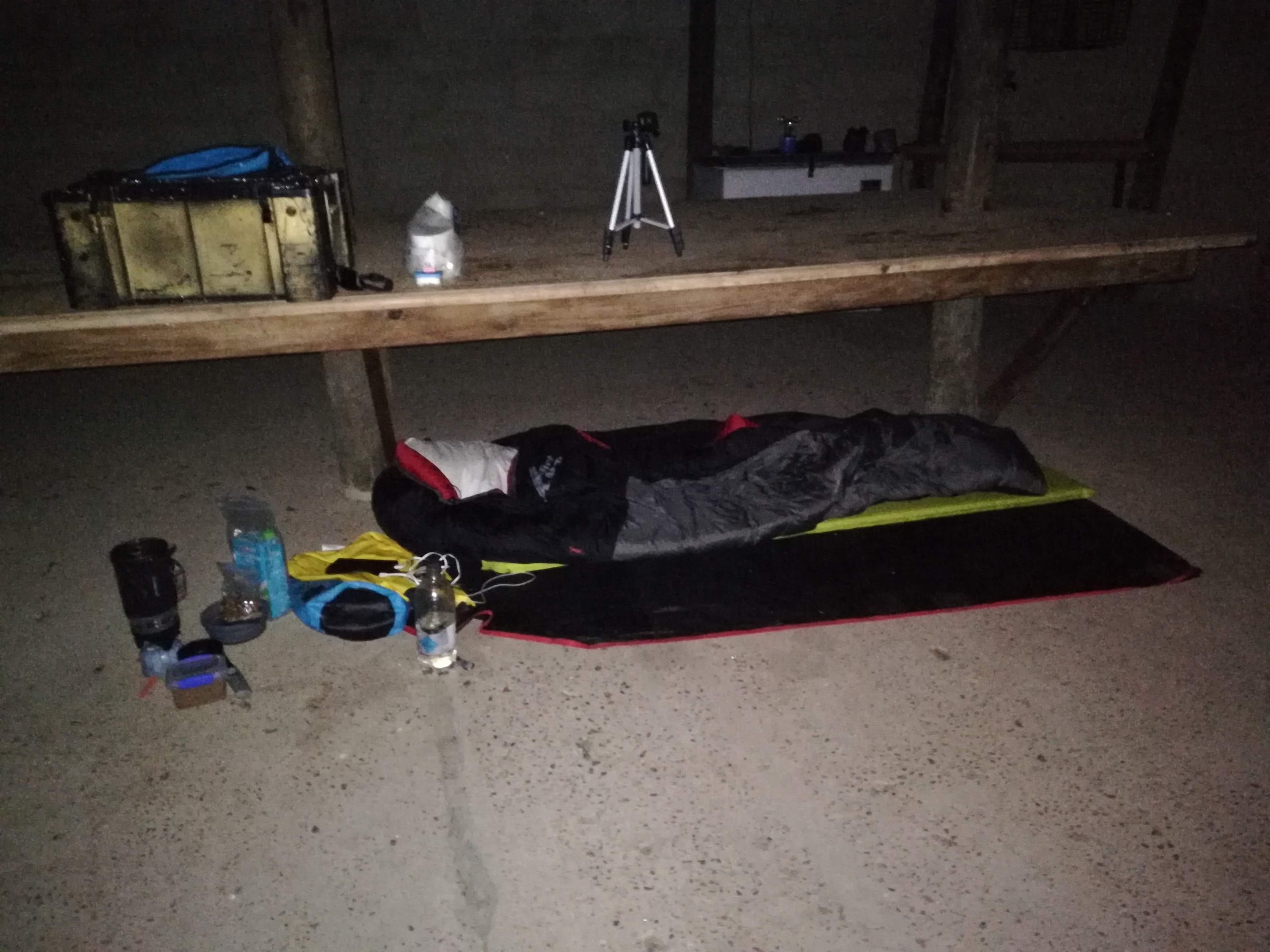 Sleeping bag laid out for the night under a bench at the Napkysmond farm shed